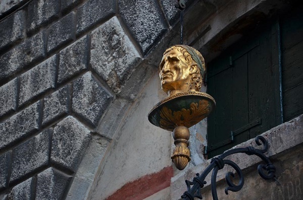 A small sculptured bronze head above a very special apothecary shop